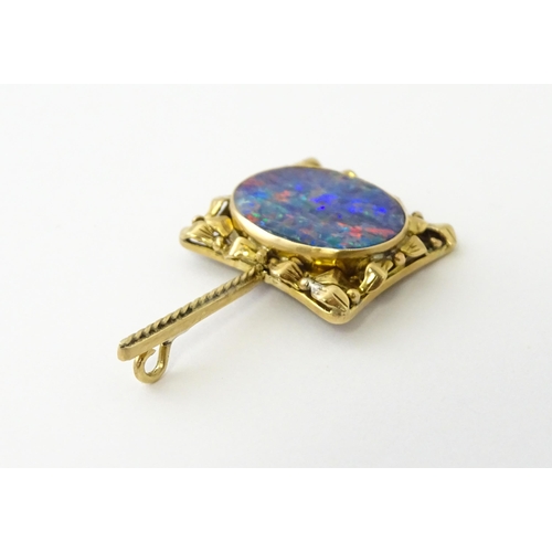 633 - A 9ct gold pendant set with central opal. Approx. 1 1/2