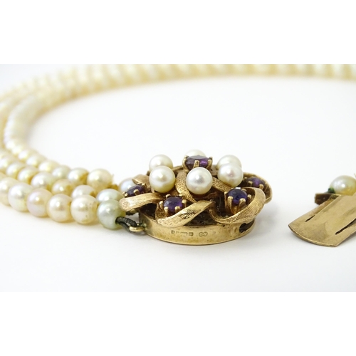 637 - A three strand graduated cultured pearl necklace with 9ct gold cluster snap clasp set with 6 culture... 