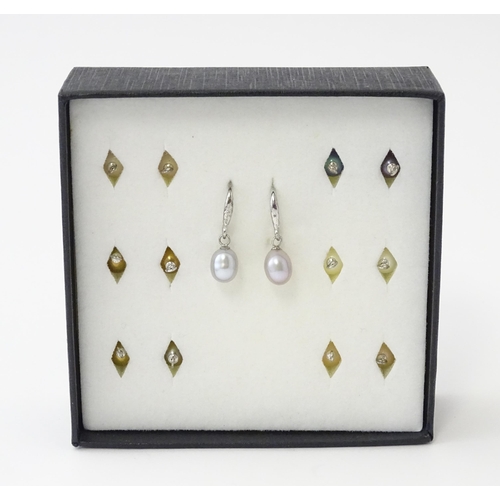 639 - A pair of silver pearl earrings with interchangeable pearls