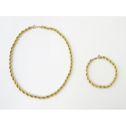 651 - A 9ct gold twist necklace. Together with a 9ct gold matching bracelet. Necklace approx. 18