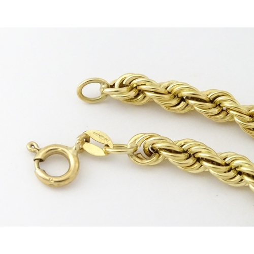 651 - A 9ct gold twist necklace. Together with a 9ct gold matching bracelet. Necklace approx. 18