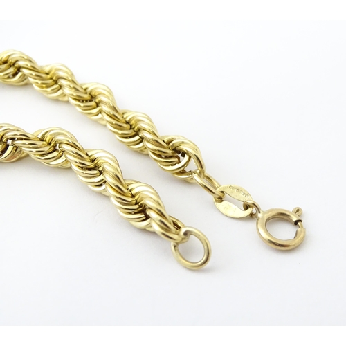 651 - A 9ct gold twist necklace. Together with a 9ct gold matching bracelet. Necklace approx. 18