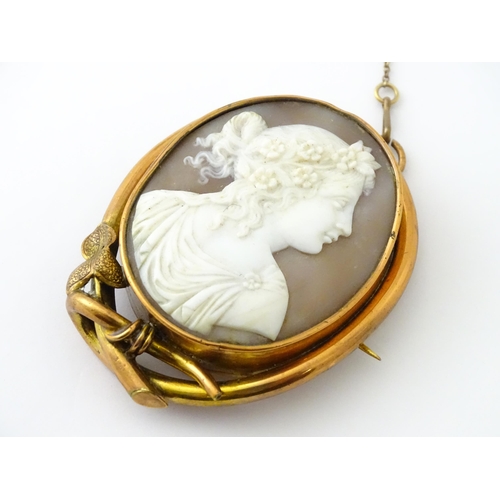 655 - A shell carved cameo brooch in a gilt metal mount. Approx. 2 1/2