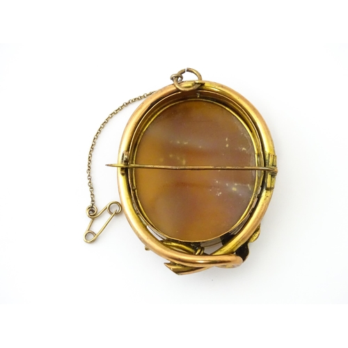 655 - A shell carved cameo brooch in a gilt metal mount. Approx. 2 1/2