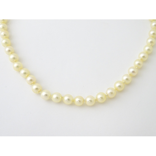 658 - A pearl necklace with a 9ct gold clasp. Approx. 15