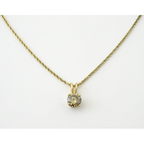 659 - A 14ct gold chain with pendant set with brown diamond. Diamond approx. 4mm, Chain approx. 18