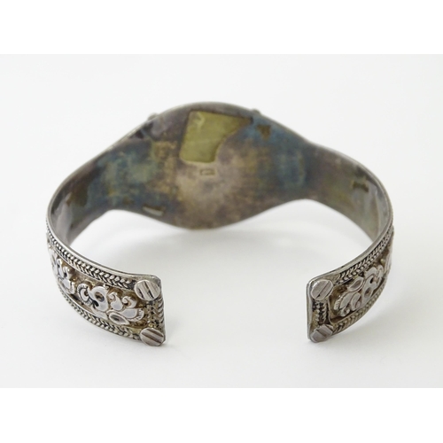 662 - A Continental white metal bracelet set with lapis lazuli. Probably Egyptian.