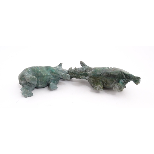 1225 - A quantity of 20thC carved models of animals to include elephant, dolphin, seal, rhinoceros, etc. To... 