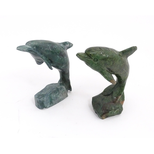 1225 - A quantity of 20thC carved models of animals to include elephant, dolphin, seal, rhinoceros, etc. To... 