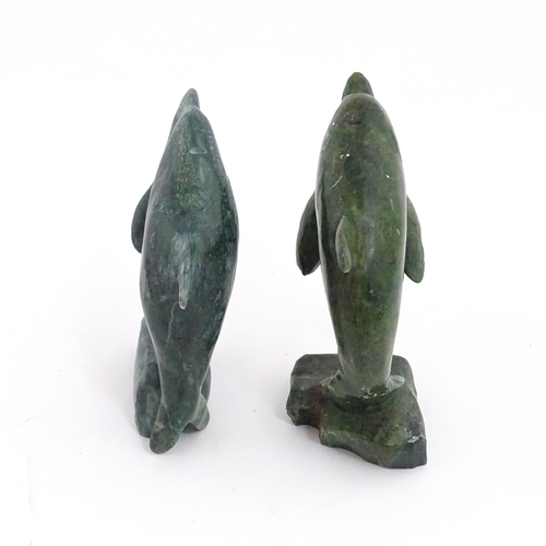 1225 - A quantity of 20thC carved models of animals to include elephant, dolphin, seal, rhinoceros, etc. To... 