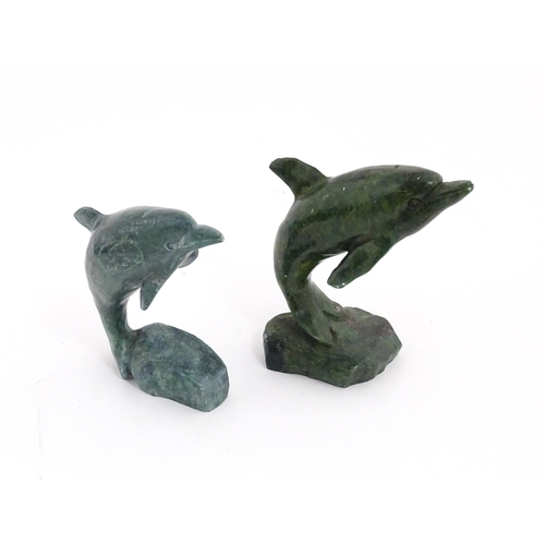 1225 - A quantity of 20thC carved models of animals to include elephant, dolphin, seal, rhinoceros, etc. To... 