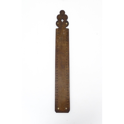 1229 - Treen : A 19thC beech Friesland mangle board with carved flower heads, roundels, etc. later converte... 