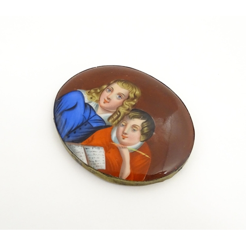 1233 - A 19thC porcelain plaque of oval form with hand painted detail depicting a young boy writing with a ... 