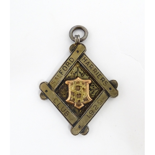 1242 - An early 20thC 9ct gold Salford Harriers Club fob / medal for 1927 hallmarked Birmingham 1927 (appro... 