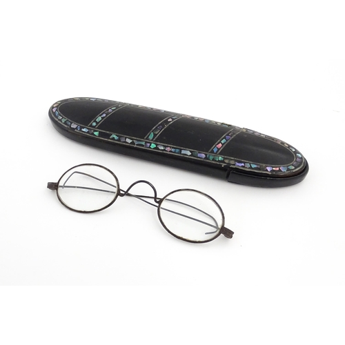 1248 - A Victorian papier mache glasses case with abalone detail, containing 19thC spectacles. Case approx.... 