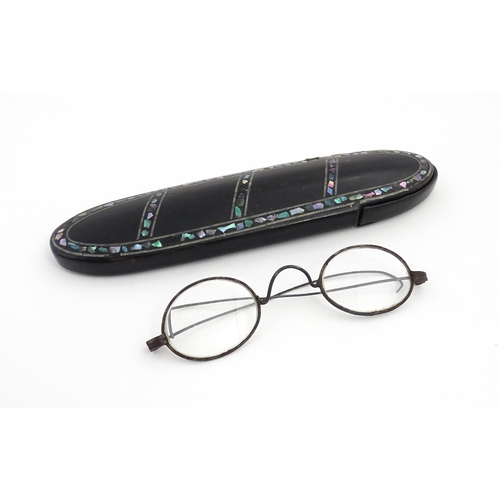 1248 - A Victorian papier mache glasses case with abalone detail, containing 19thC spectacles. Case approx.... 