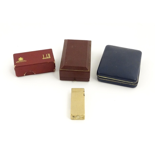 1249 - A 9ct gold Dunhill cigarette lighter, hallmarked 1965, maker Alfred Dunhill. Approx. 2 1/2