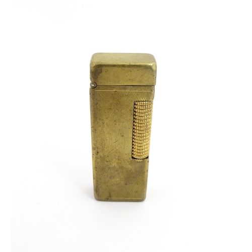 1251 - A Dunhill 'Rollagas' pocket lighter, stamped under. Approx 2 1/2