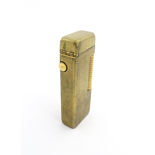 1251 - A Dunhill 'Rollagas' pocket lighter, stamped under. Approx 2 1/2