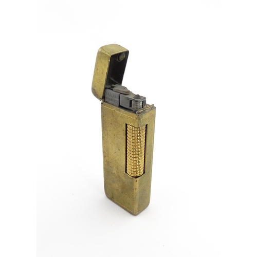 1251 - A Dunhill 'Rollagas' pocket lighter, stamped under. Approx 2 1/2