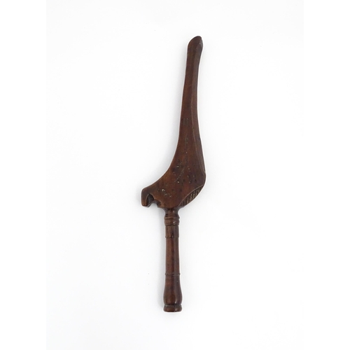 1256 - Treen : A 19thC treen gull wing knitting stick with carved floral decoration. Approx. 11 1/2