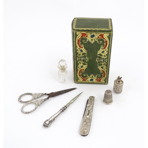 1258 - Sewing Interest : A 19thC leather etui / necessaire / lady's companion with tooled scrolling decorat... 