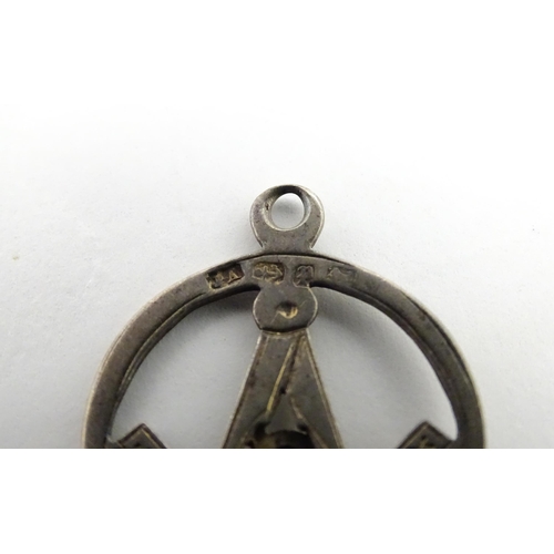 1264 - Freemasonry / Masonic Interest: A silver Masonic pendant fob hallmarked 1889, maker JA. Together wit... 