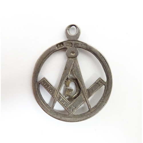 1264 - Freemasonry / Masonic Interest: A silver Masonic pendant fob hallmarked 1889, maker JA. Together wit... 