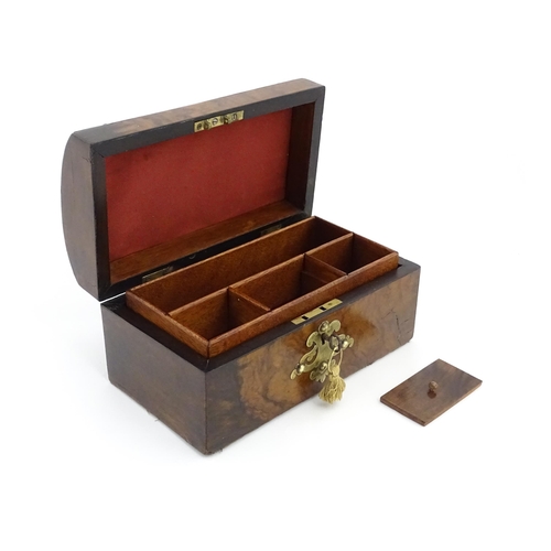 1269 - A 19thC walnut box, the dome top with applied brass mounts, opening to reveal a fitted interior and ... 