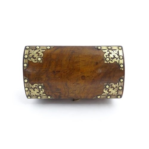 1269 - A 19thC walnut box, the dome top with applied brass mounts, opening to reveal a fitted interior and ... 