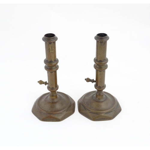 1279 - A pair of 19thC brass ejector candlesticks. Approx. 6 1/2