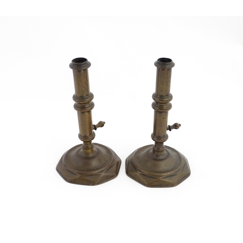 1279 - A pair of 19thC brass ejector candlesticks. Approx. 6 1/2