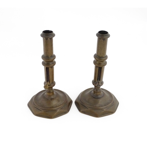 1279 - A pair of 19thC brass ejector candlesticks. Approx. 6 1/2