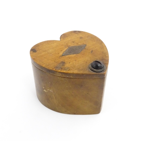 1280 - Treen : A late 19thC box of heart form with swivel lid, the top with applied lozenge engraved W. Web... 