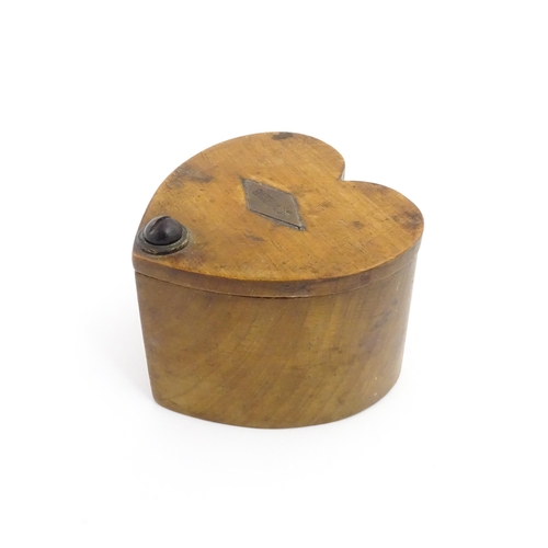 1280 - Treen : A late 19thC box of heart form with swivel lid, the top with applied lozenge engraved W. Web... 