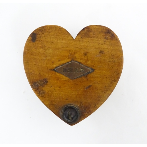 1280 - Treen : A late 19thC box of heart form with swivel lid, the top with applied lozenge engraved W. Web... 