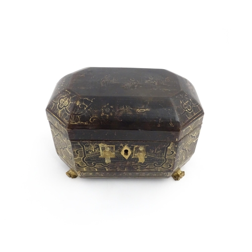 1281 - A 19thC lacquered casket of octagonal form raised on four paw feet, with chinoiserie decoration depi... 