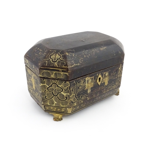 1281 - A 19thC lacquered casket of octagonal form raised on four paw feet, with chinoiserie decoration depi... 