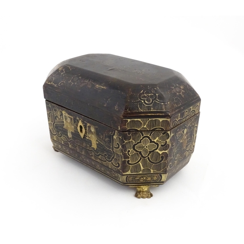 1281 - A 19thC lacquered casket of octagonal form raised on four paw feet, with chinoiserie decoration depi... 