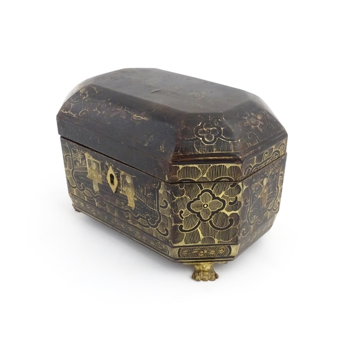 1281 - A 19thC lacquered casket of octagonal form raised on four paw feet, with chinoiserie decoration depi... 