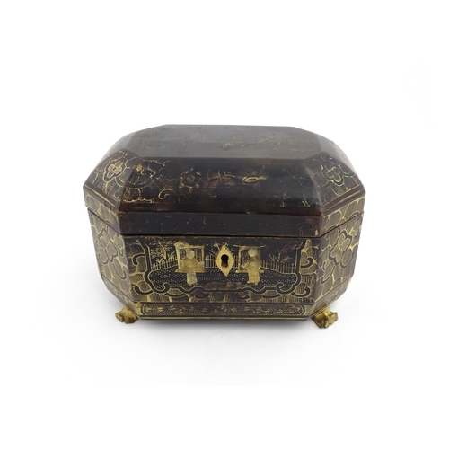 1281 - A 19thC lacquered casket of octagonal form raised on four paw feet, with chinoiserie decoration depi... 