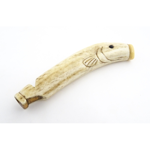 1282 - A 19thC novelty carved antler whistle of fish form. Approx. 5 1/4