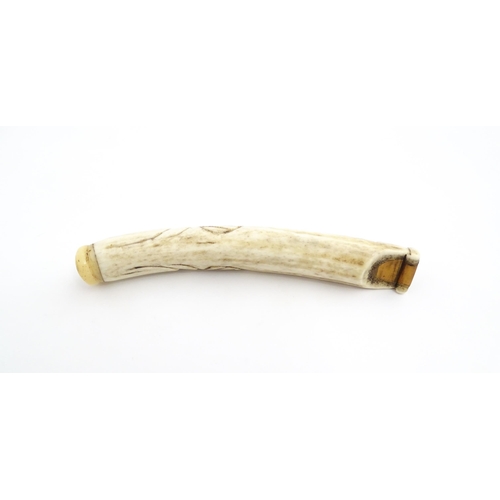 1282 - A 19thC novelty carved antler whistle of fish form. Approx. 5 1/4