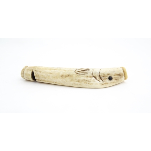 1282 - A 19thC novelty carved antler whistle of fish form. Approx. 5 1/4