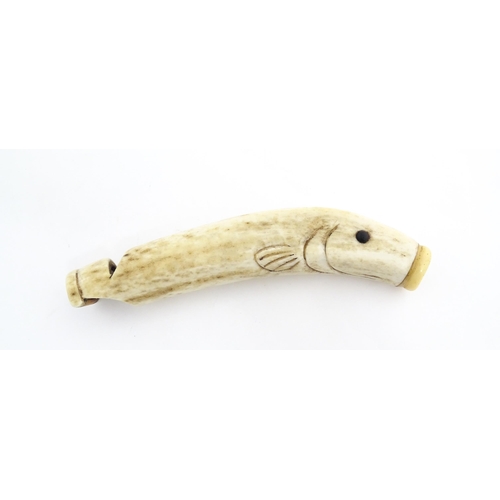 1282 - A 19thC novelty carved antler whistle of fish form. Approx. 5 1/4