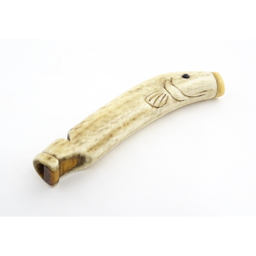 1282 - A 19thC novelty carved antler whistle of fish form. Approx. 5 1/4