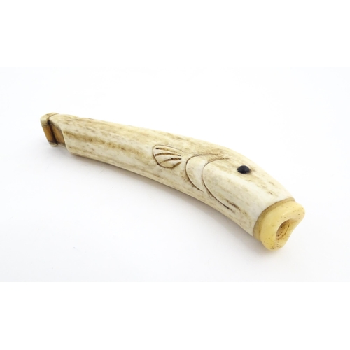 1282 - A 19thC novelty carved antler whistle of fish form. Approx. 5 1/4