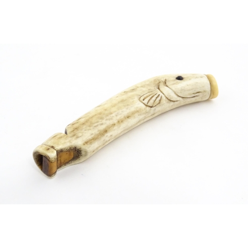 1282 - A 19thC novelty carved antler whistle of fish form. Approx. 5 1/4