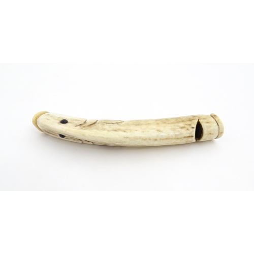 1282 - A 19thC novelty carved antler whistle of fish form. Approx. 5 1/4