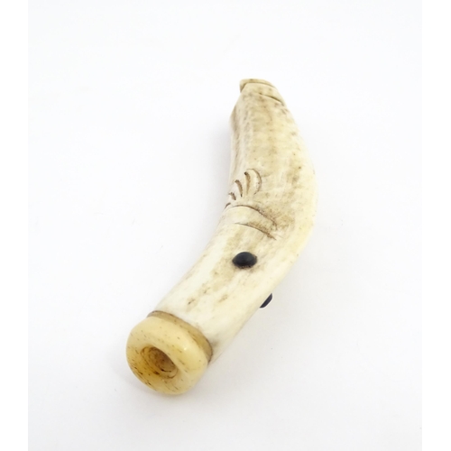 1282 - A 19thC novelty carved antler whistle of fish form. Approx. 5 1/4